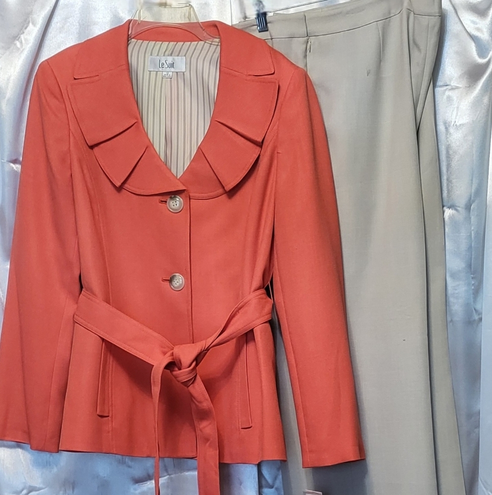 Le Suit 2 Piece Pantsuit with notched lapel coral jacket and tan slacks